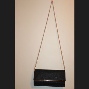 Black purse with gold chain